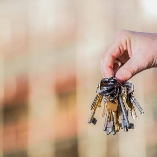 Bunch of keys in hand of elegant man