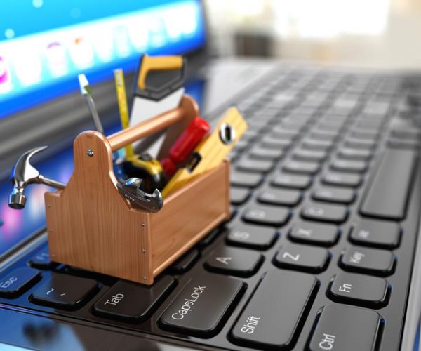 Online support. Toolbox with tools on laptop. 3d